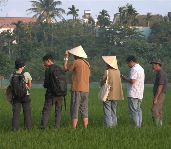 Walking the rice field with the farmer.